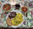 Sauteed vegetables and scallops awaiting addition of scrambled eggs